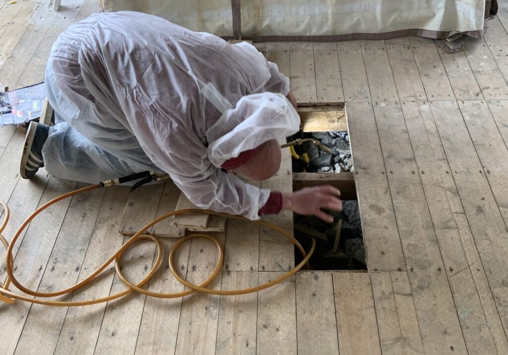 timber treatment proctect against damp man treating timber for rot